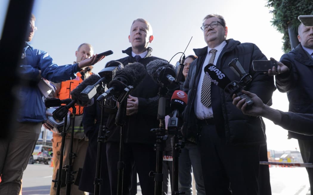 Prime Minister Chris Hipkins, Wellington Central MP and Finance Minister Grant Robertson and Wellington mayor Tory Whanau at the scene of the fire at Loafers Lodge hostel, Newtown.