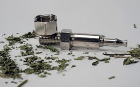 Synthetic cannabis and a pipe.