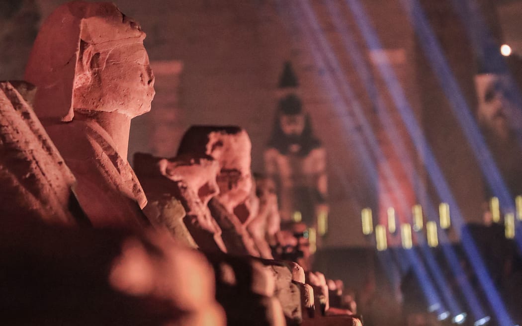 This picture taken on November 25, 2021 shows a view of the human-headed sphinxes along the 2700-metre-long "Rams Road" leading from the Temple of Luxor (background) to the Karnak Temple (unseen) further north, in Egypt's southern city of the same name.