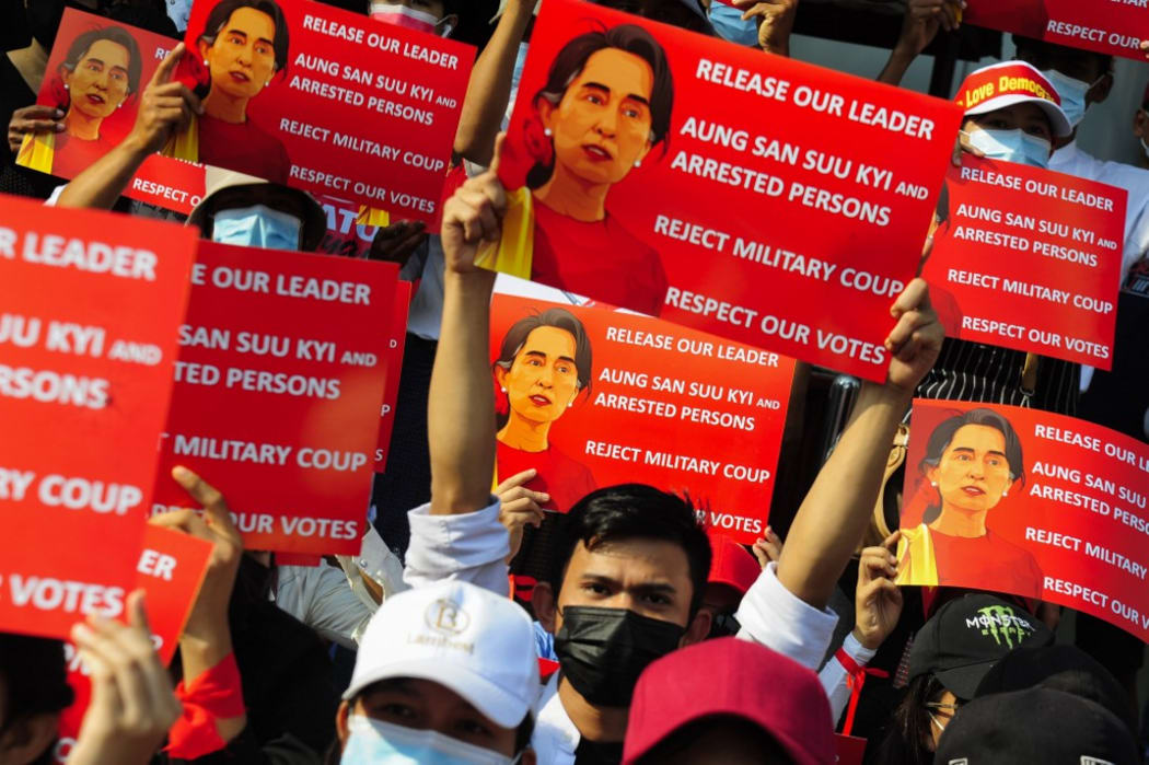 YANGON, MYANMAR - FEBRUARY 20: Anti-coup protesters hold placards as they protest against the military coup Saturday, February 20, 2021, in Yangon, Myanmar. Stringer / Anadolu Agency