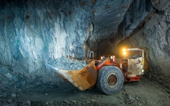Working inside gold mine tunnel. Gold mining.