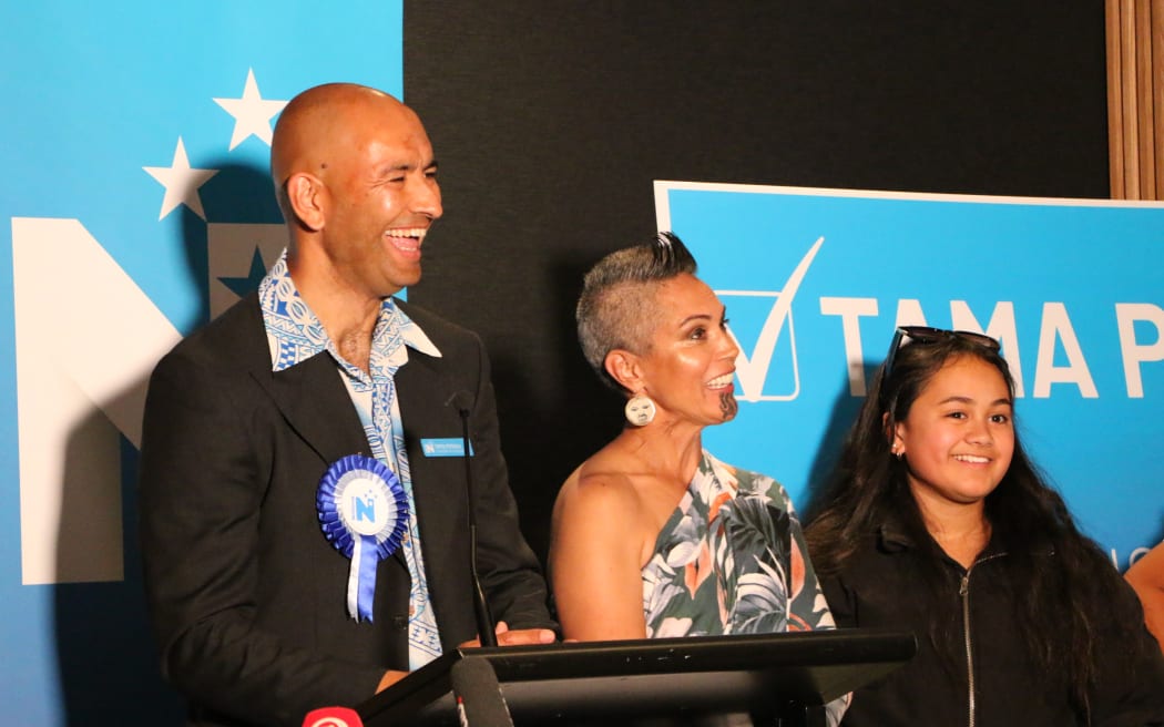 Tama Potaka up on stage with his whanau after preliminary votes show he has won the Hamilton West seat by a comfortable margin.