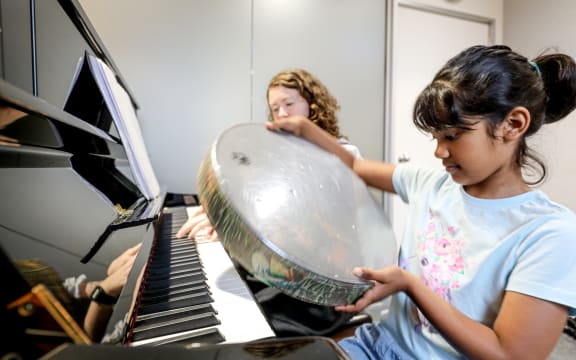 Kiara's music therapist Aliss Pollock has helped her learn about various instruments.