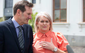 Olivia Podmore's stepfather Chris Middleton (left) and mother Nienke Middleton (right) outside the Hamilton District Court.