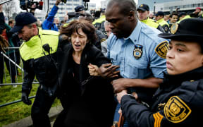Florence Hartmann is arrested before the reading of the verdict against Bosnian Serb leader Radovan Karadzic on 24 March 2016.