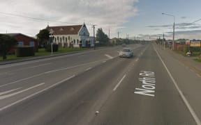 Police officers found the woman's body at a North Rd address on Sunday morning.