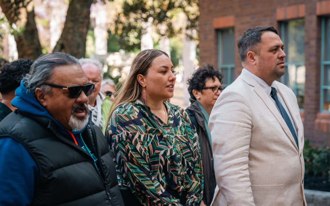 Kaipara District Council Māori Ward councillor Pera Paniora (centre) walks into the High Court at Auckland today with supporters.