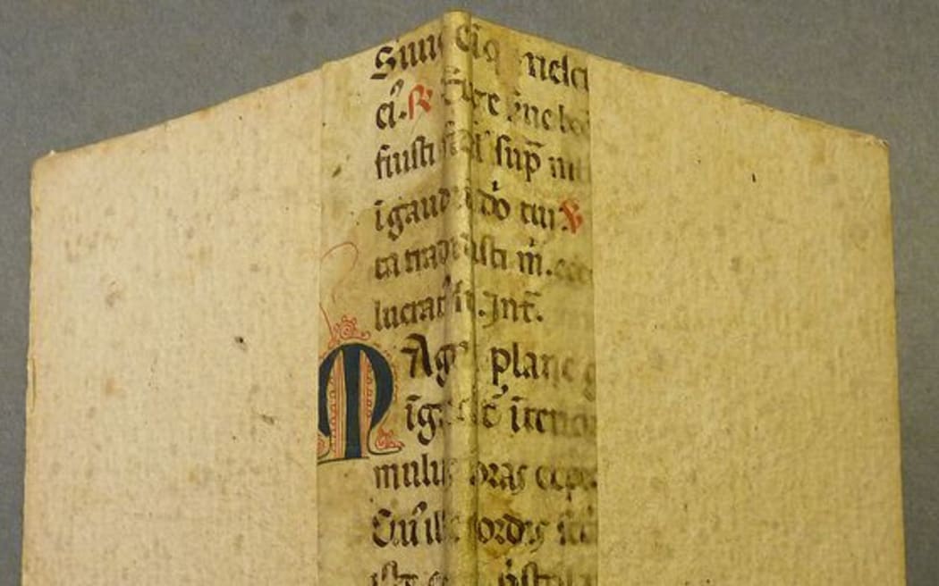 Portion of an early parchment leaf from a liturgical manuscript, probably a breviary, used as binder's waste