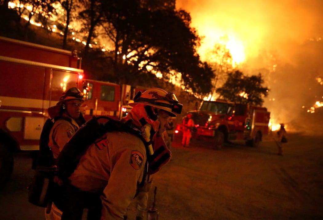 Firefighters prepare to start a backfire operation ahead of the Rocky Fire.