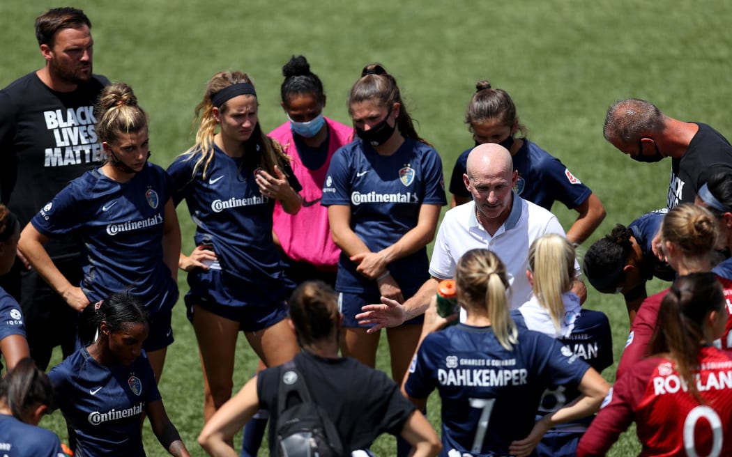 Paul Riley head coach of North Carolina Courage talks with the team after being defeated by the Portland Thorns FC in the quarterfinal match against the Portland Thorns FC in the the NWSL Challenge Cup at Zions Bank Stadium on July 17, 2020 in Herriman, Utah.