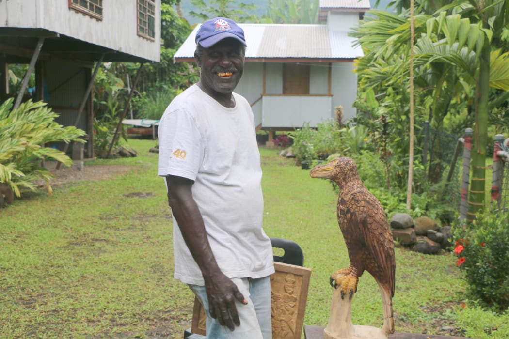 Joe Dutaona, master wood carver outside his studio in Arawa, Bougainville.