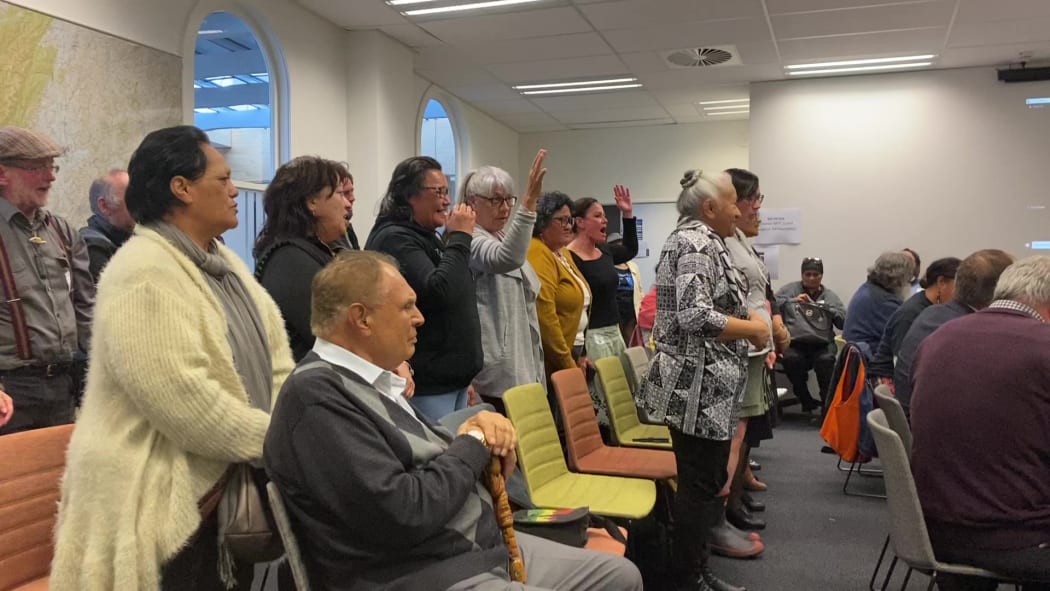 Members of the public gallery celebrate after the vote to establish Māori wards in the district.