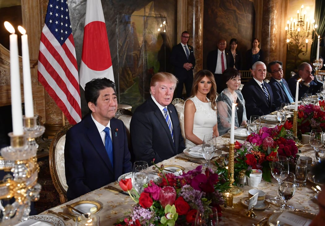 US President Donald Trump, First Lady Melania Trump, Japan's Prime Minister Shinzo Abe, and his wife Akie Abe take part in a dinner at Trump's Mar-a-Lago estate.