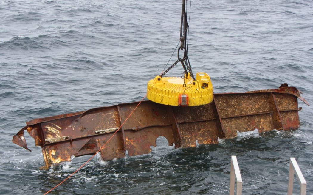 A giant magnet has been used to pull large parts of the wreck from the sea.