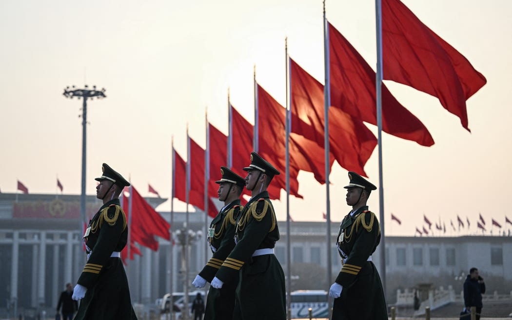 Chinese People’s Liberation Army soldiers patrol at Tiananmen Square ahead of the second plenary session of the Chinese People's Political Consultative Conference (CPPCC) in Beijing on 7 March, 2024.