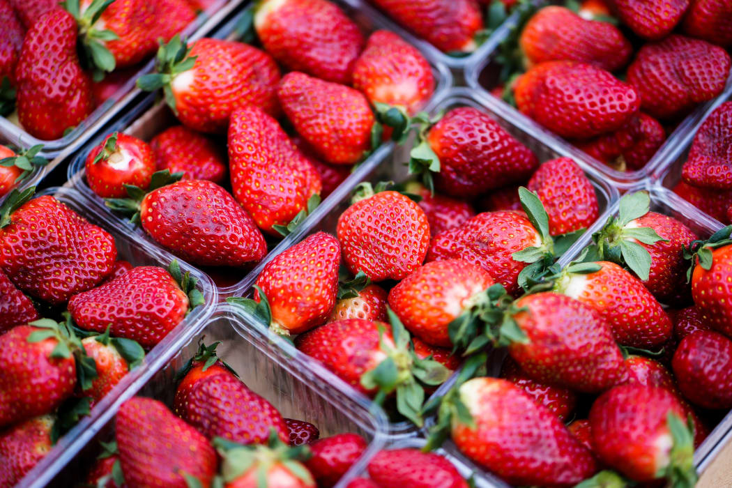 Strawberries in plastic container.