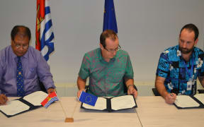 Kiribati Minister, Teuea Toatu; EU Ambassador to the Pacific, Andrew Jacobs and General Manager, NETCON representative Luke van Zeller.