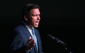 ROTHSCHILD, WISCONSIN - MAY 06: Florida Governor Ron DeSantis speaks to guests at the Republican Party of Marathon County Lincoln Day Dinner annual fundraiser on May 06, 2023 in Rothschild, Wisconsin. Although he has not yet announced his candidacy, DeSantis is expected to be among the top contenders vying for the Republican presidential nomination next year.   Scott Olson/Getty Images/AFP (Photo by SCOTT OLSON / GETTY IMAGES NORTH AMERICA / Getty Images via AFP)