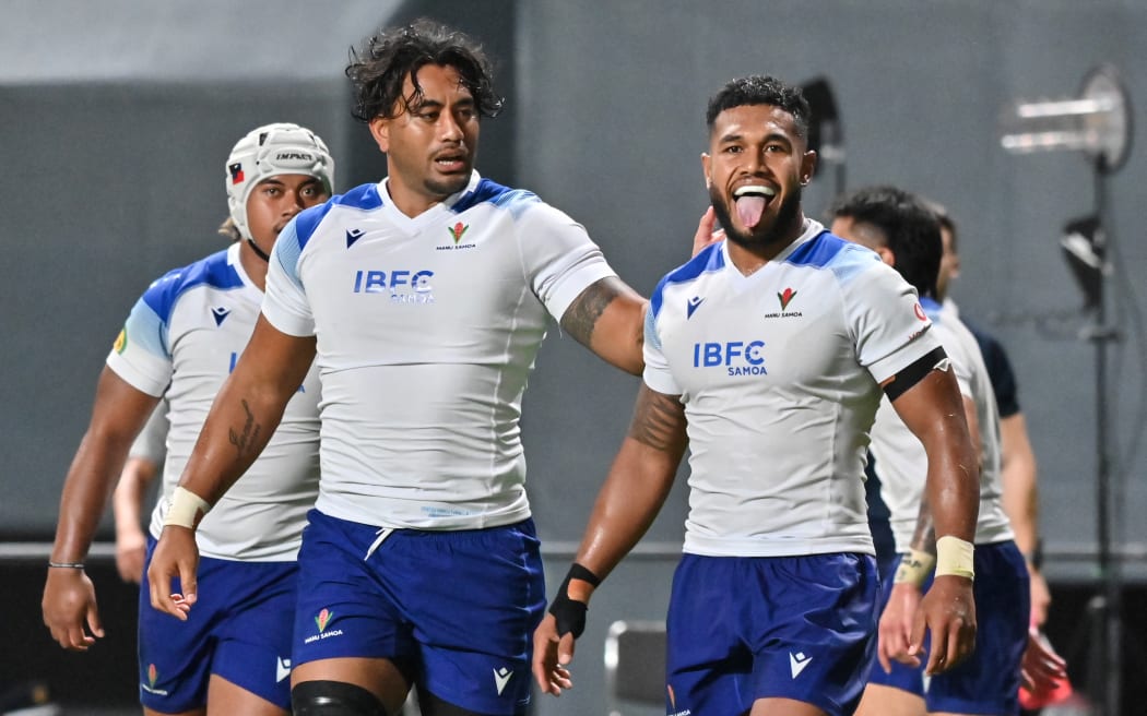 Samoa's Tumua Manu (R) celebrates after scoring a try against Japan in Sapporo.
