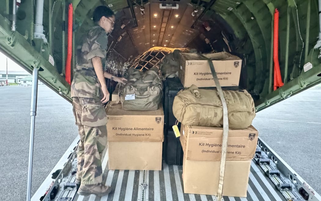 French forces deliver hygiene kits at the Port Vila airport after a massive quake in Vanuatu.