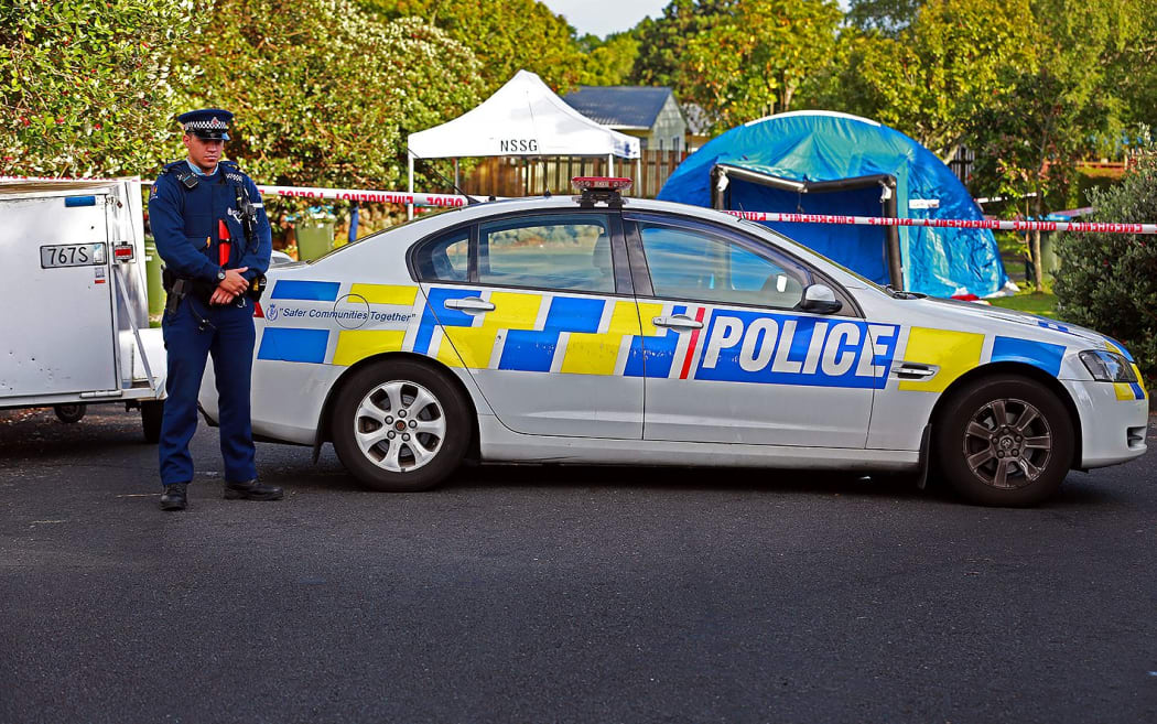 Police at the scene of the fatal stabbing on Renton Road in Mt Albert