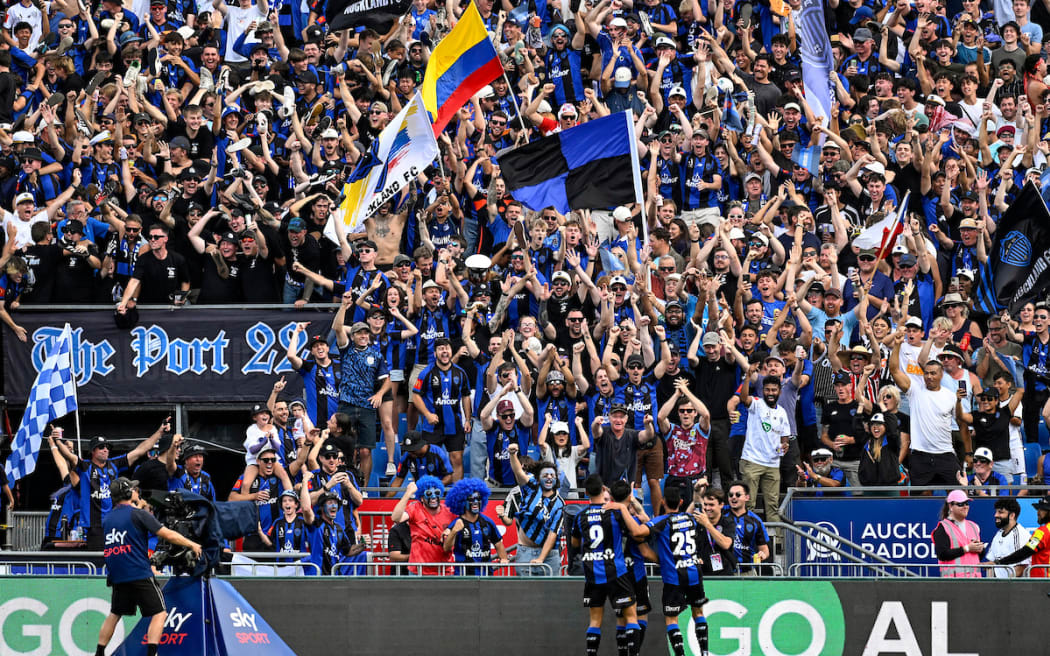 Auckland FC fans and supporters celebrate a goal by Neyder Moreno.