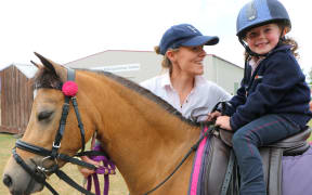 Greer Hazlett, 4, on her pure-bred Section A Welsh pony.