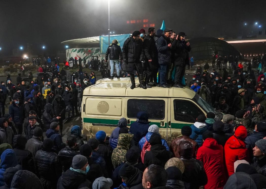 Protesters take part in a rally over a hike in energy prices in Almaty on January 5, 2022. - Kazakhstan on January 5, 2022 declared a nationwide state of emergency