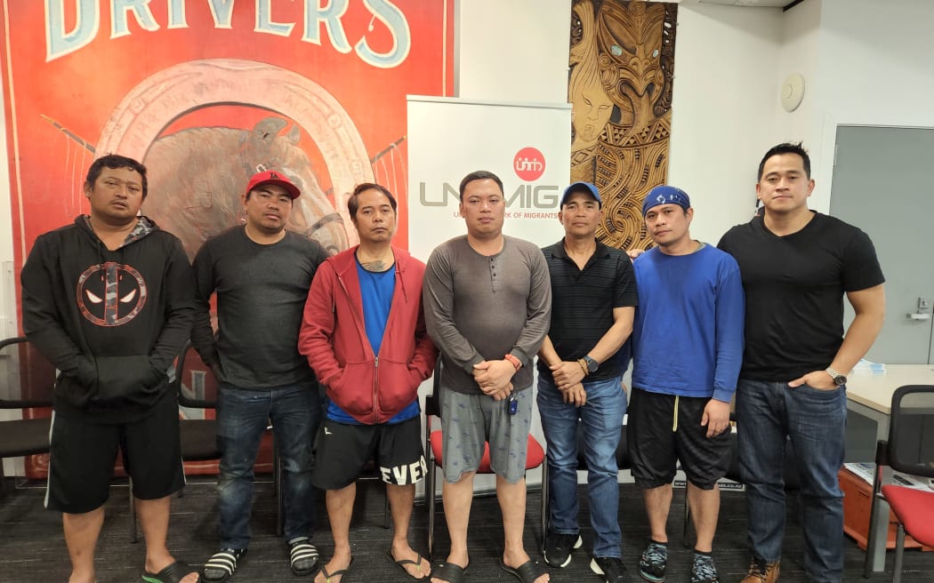 First Union's organiser Mikee Santos (far right) represents a group of a group of Filipino construction workers, who say their former employer Rehua Reo Contracting owe them weeks' worth of wages.