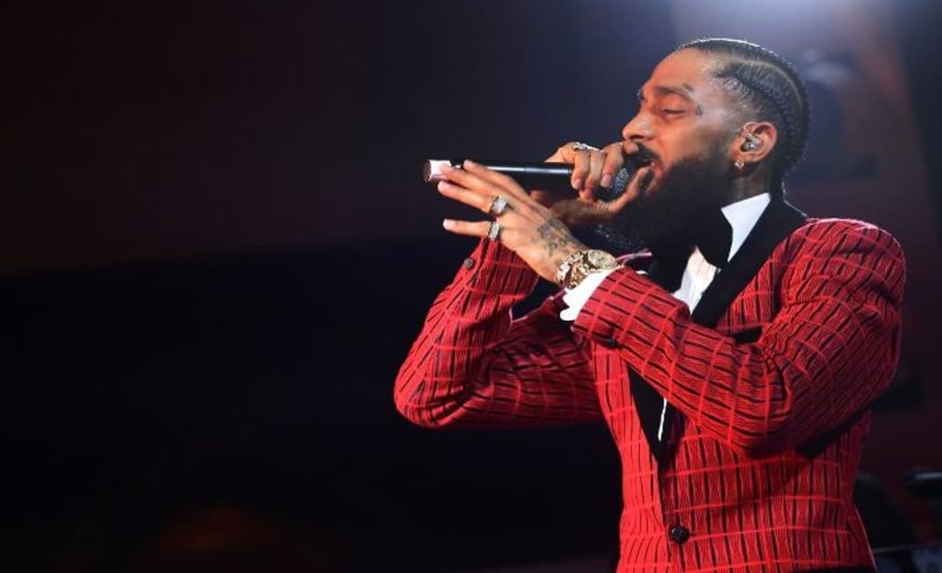 (FILES) In this file photo taken on February 07, 2019 Nipsey Hussle performs onstage at the Warner Music Pre-Grammy Party at the NoMad Hotel in Los Angeles. -