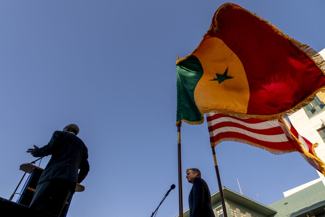 US Secretary of State Antony Blinken (R) looks on as he is introduced by US Ambassador to Senegal Tulinabo Mushingi (L) as he greets employees and their families at the US Embassy in Dakar, on November 20, 2021.