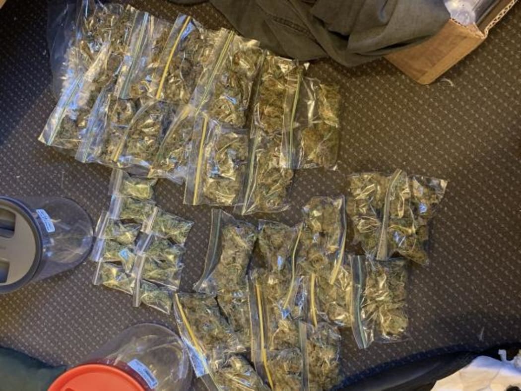Police search warrants uncovered 2.5kg of cannabis, cash and LSD.