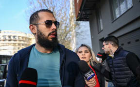 Controversial influencer Andrew Tate arrives at the Directorate for the Investigation of Organized Crime and Terrorism (DIICOT) to attend a hearing on April 10, 2023. Andrew Tate and his brother Tristan were released after three months of pre-trial detention in Romania and moved to house arrest while they continue to be investigated for allegedly "forming an organised criminal gang, human trafficking and rape". The transfer comes after an appeals court rejected a further extension of the Tates' detention and ordered that the pair were released with restrictions. A former professional kickboxer, Andrew Tate's videos on social media -- which often contain misogynistic and violent themes -- are watched by an audience of millions, comprised predmoninantly of teenage boys. (Photo by Daniel MIHAILESCU / AFP)