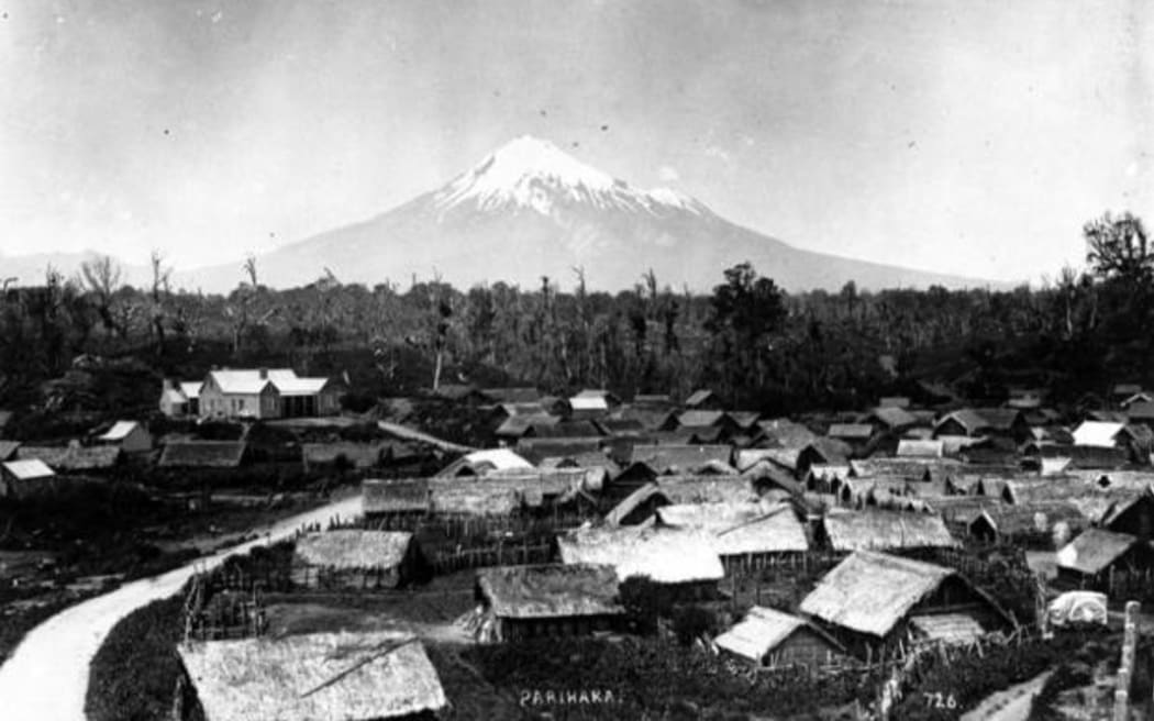 Parihaka Pa, circa 1900, with Mount Taranaki - taken by an unidentified photographer.
