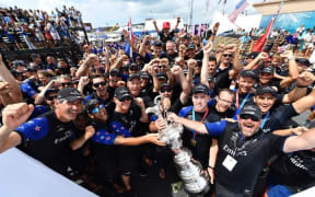 Team NZ celebrates their 7-1 win over Oracle Team USA in the 35th America's Cup