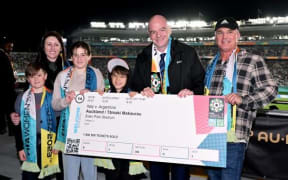 Harry Strong, Maria Strong, Isobel Strong, Boston Roxburgh, FIFA President Gianni Infantino and Jason Roxburgh.
The family purchased the 1.5 millionth ticket for the World Cup.