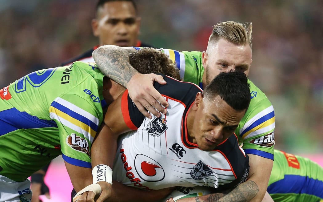 Ken Maumalo of the Warriors is tackled during the NRL Rugby League match between Canberra Raiders.