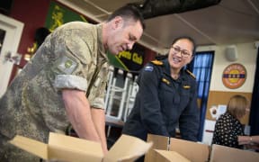 About 40 schoolchildren, veterans, staff from Foodstuffs and Z Energy, and New Zealand Defence Force personnel packed hundreds of Christmas treats this morning for NZDF personnel serving overseas.