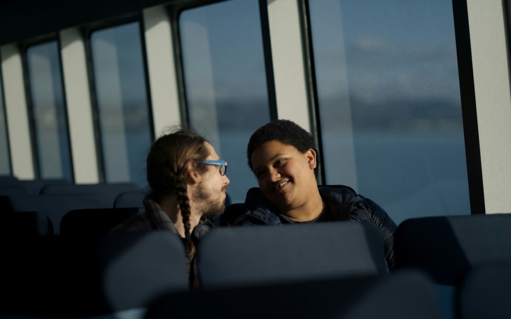 couple talking on a bus