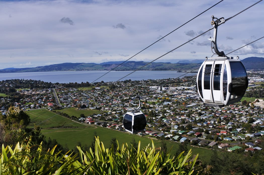 Riding cable car above Rotorua lake and city, in the centre of North Island of New Zealand
