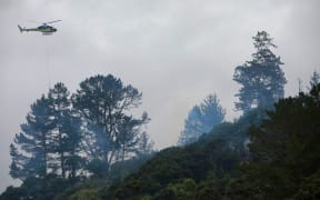A scrub fire is burning in Kaipara, closing part of SH16