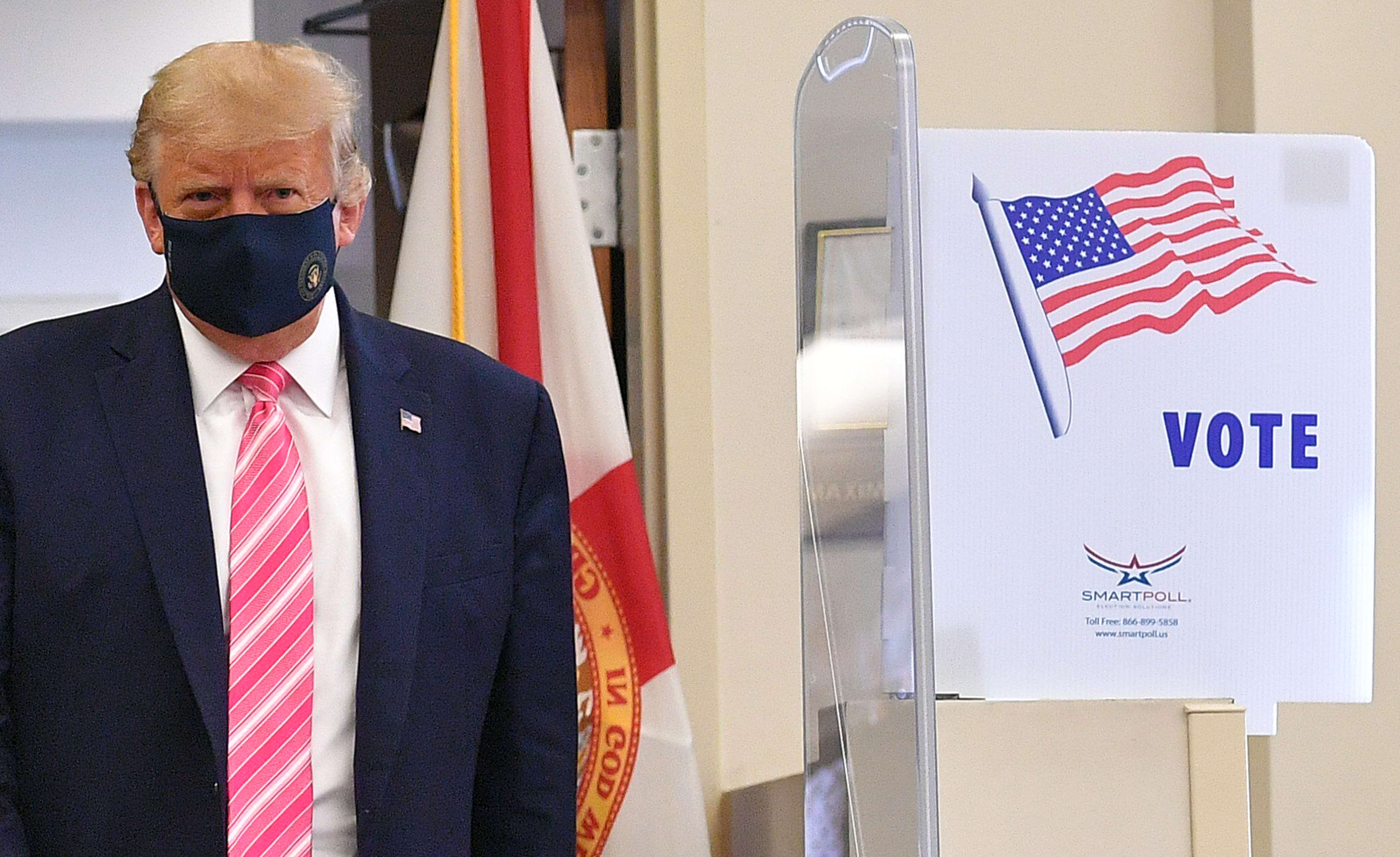 Donald Trump leaves the polling station after casting his ballot at the Palm Beach County Public Library, during early voting for the 3 November election.