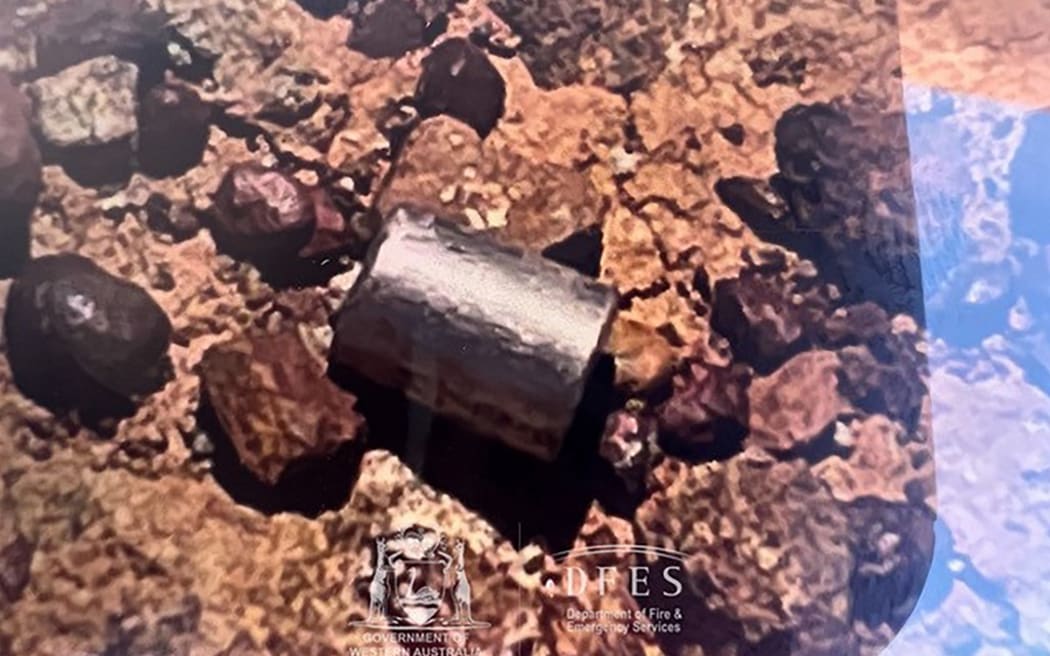 This handout from the Government of Western Australia's Department of Fire and Emergency Services taken and received on February 1, 2023 shows a radioactive capsule, which had fallen off a truck, after it was found along a desert highway south of Newman, Western Australia. - A tiny but dangerously radioactive capsule, which fell off a truck along a remote stretch of Outback highway in Western Australia last month, was found on February 1, authorities said. (Photo by Handout / various sources / AFP) / -----EDITORS NOTE --- RESTRICTED TO EDITORIAL USE - MANDATORY CREDIT "AFP PHOTO / GOVERNMENT OF WESTERN AUSTRALIA / DEPARTMENT OF FIRE AND EMERGENCY SERVICES " - NO MARKETING - NO ADVERTISING CAMPAIGNS - DISTRIBUTED AS A SERVICE TO CLIENTS