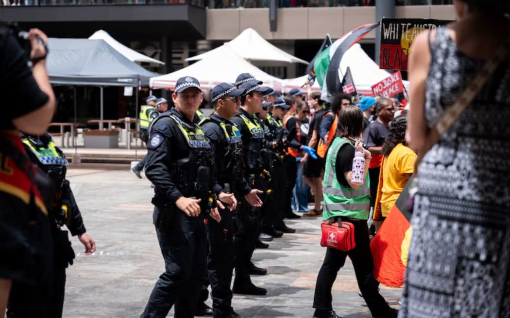 The crowd and police gather in Perth for the Invasion Day rally. ABC News: Cason Ho