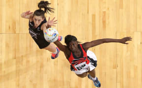 Bailey Mes of New Zealand and Kielle Connolly of Trinidad & Tobago compete for the ball.
