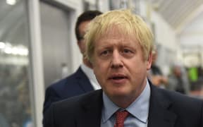 Britain's Prime Minister and Conservative leader Boris Johnson arrives at the count centre in Uxbridge, west London, as votes were counted as part of the UK general election.