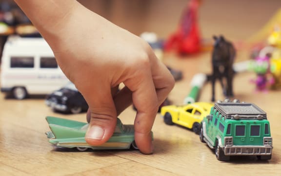 A child plays with toys at a kindergarten or early childcare centre.