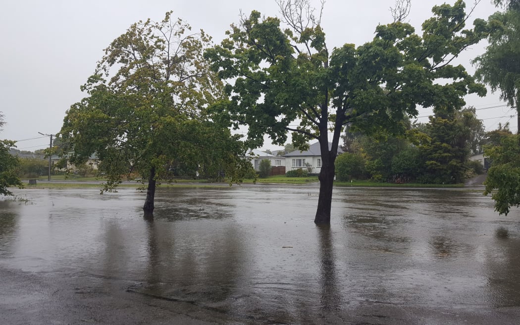 The Heathcote River in Christchurch overflows.