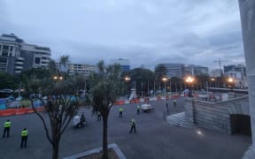 Police and protesters at Parliament grounds on Friday morning.