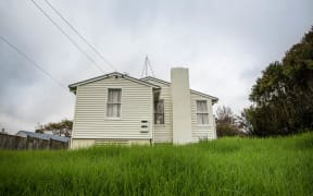 An empty state house with over grown lawns in Glen Innes that has been empty for 3 months